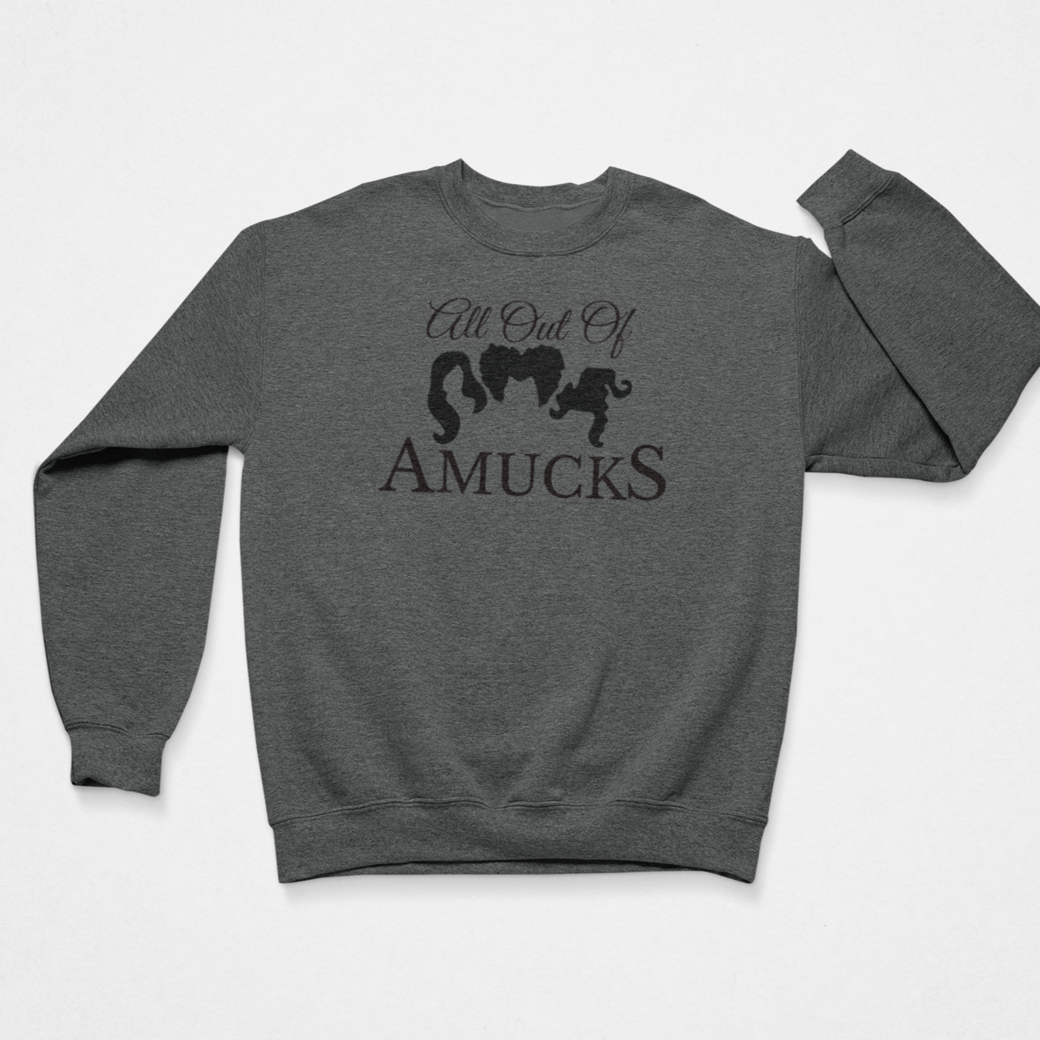 Dark gray cozy sweatshirt with the phrase "All Out of Amucks" featuring silhouettes of Hocus Pocus sisters, perfect for Halloween or fans of witch-themed humor.