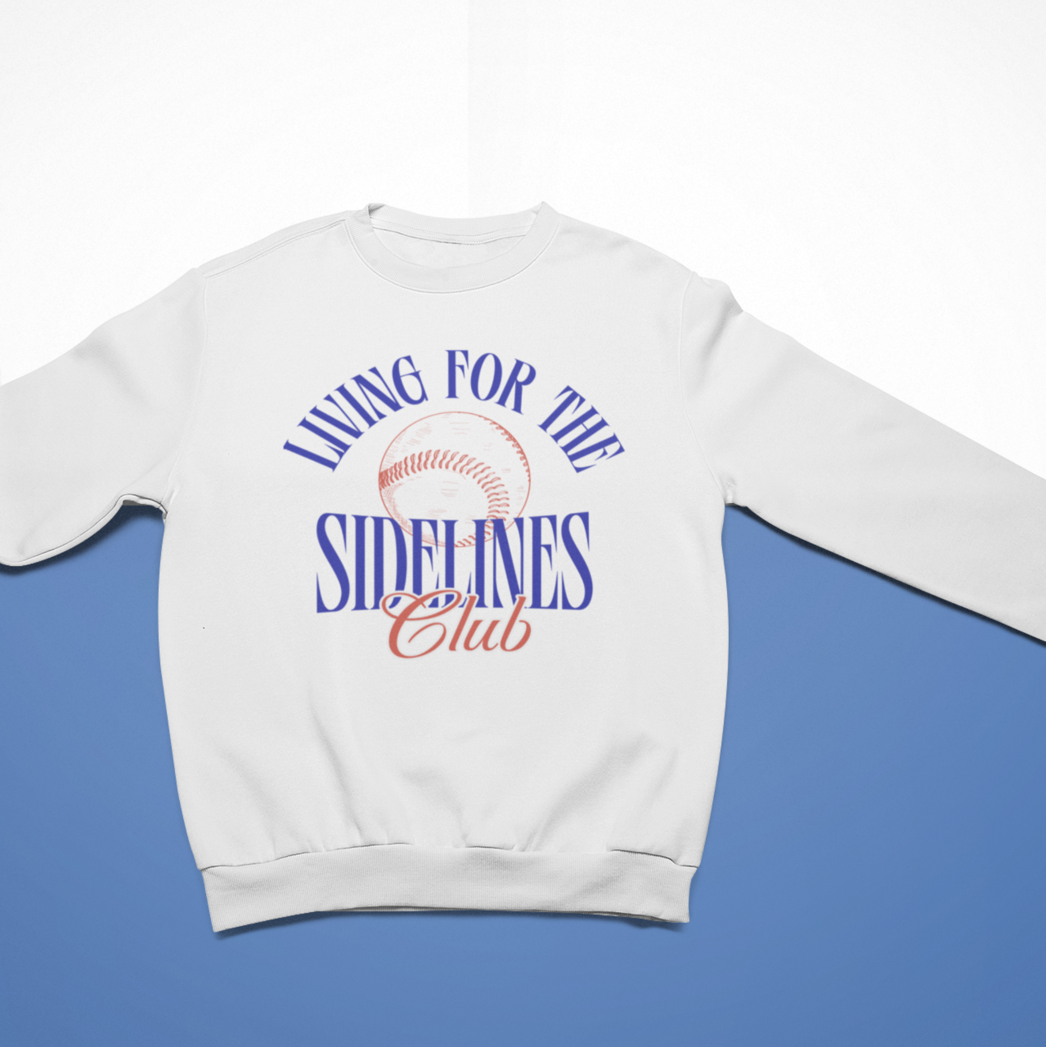 White cozy sweatshirt with the text "Living for the Sidelines Club" featuring a sketched baseball graphic, ideal for baseball fans or sports enthusiasts.