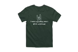 A dark green "I Was Cool Once, Now I Drive a Minivan" Short Sleeve T-Shirt with white text and a graphic on the front. The graphic features a hand making a rock 'n' roll gesture with the index and pinky fingers raised. The text reads: "I was cool once, now I drive a minivan," poking fun at minivan life and parenthood.