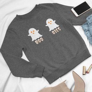 Gray cozy Halloween sweatshirt featuring two cute ghost illustrations with the playful text "BOO BIES," styled with jeans, a phone, and beige boots, perfect for casual festive wear.