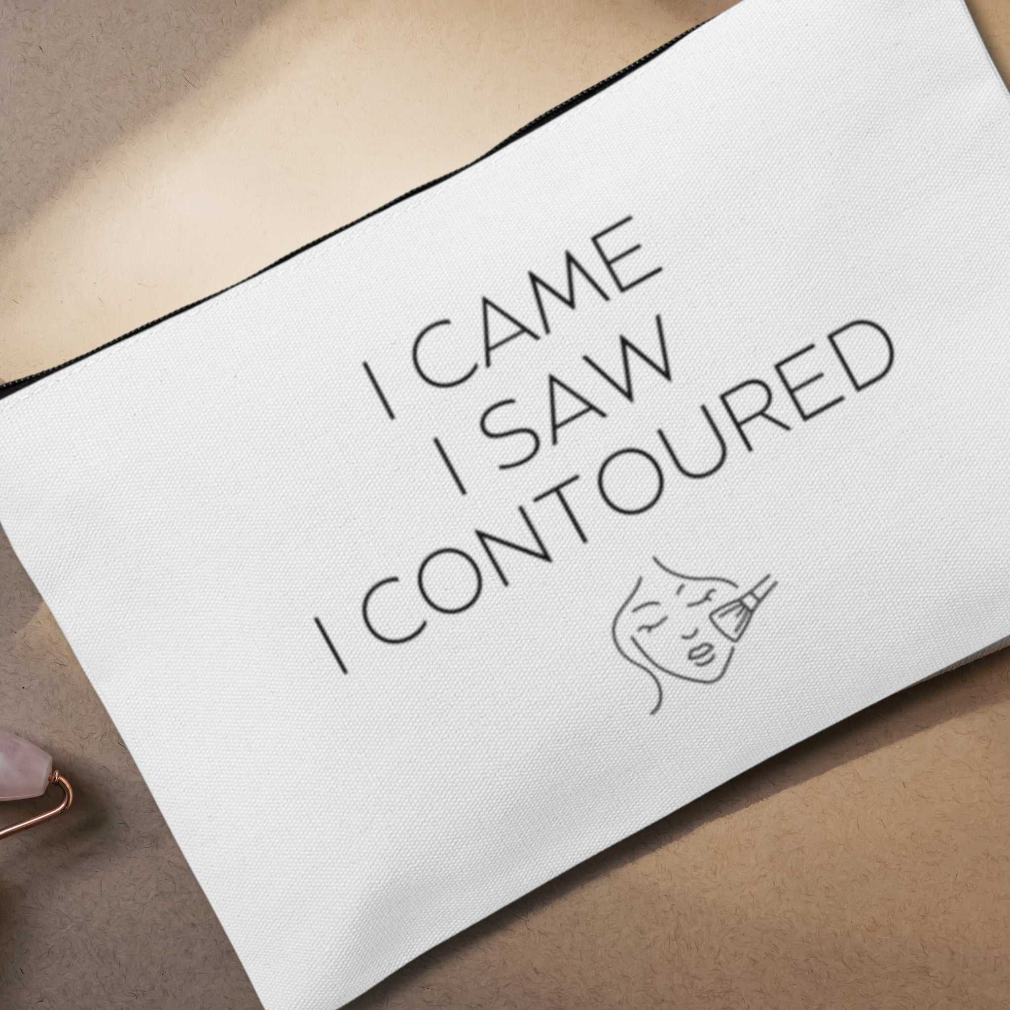 A custom makeup bag with the phrase 'I Came I Saw I Contoured,' making it a funny and stylish gift for women. Perfect for those looking for unique and personalized cosmetic bags.