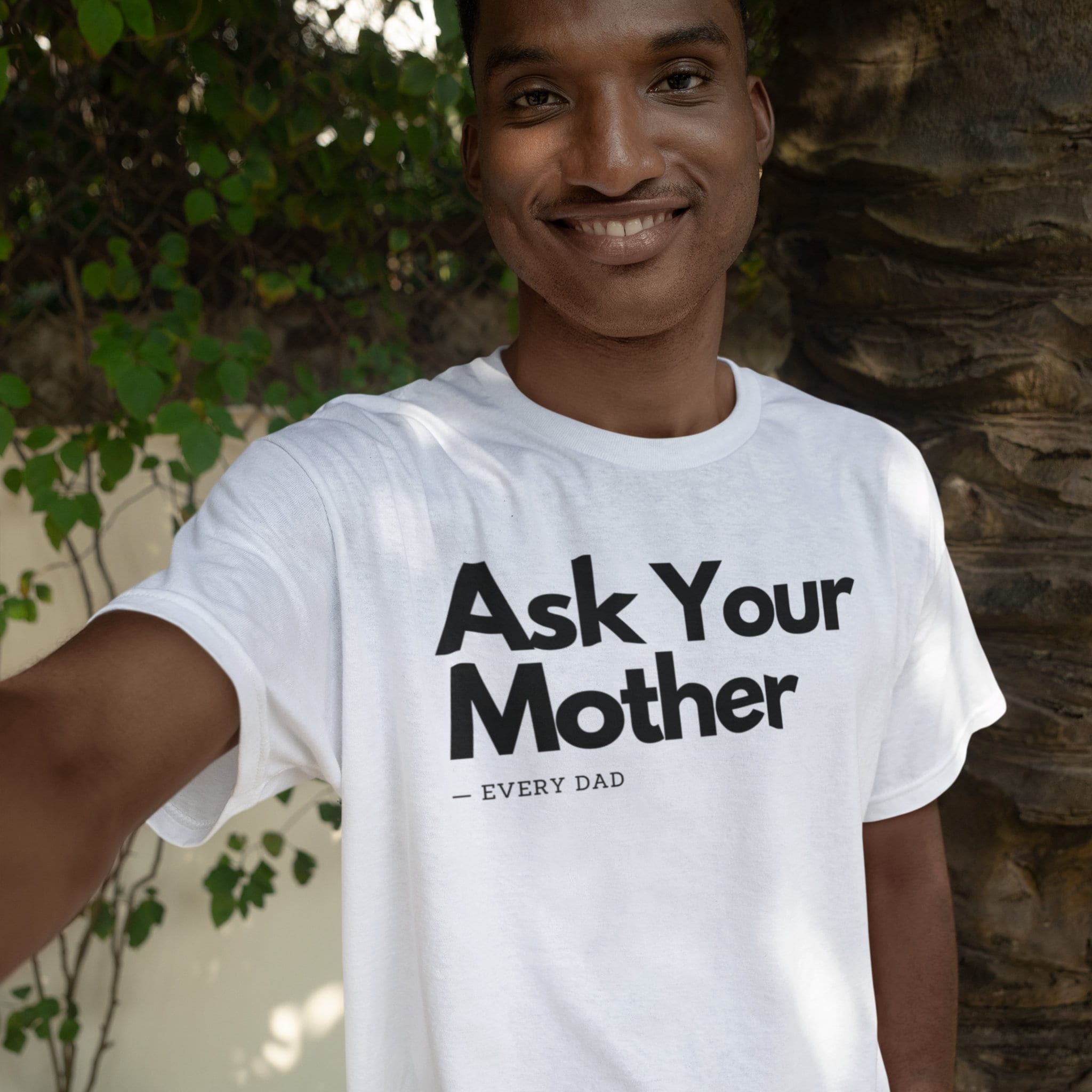 Happy man wearing a white shirt with the phrase 'Ask Your Mother,' making it a funny and custom Father's Day gift for dads. Perfect for those looking for unique and humorous dad shirts.