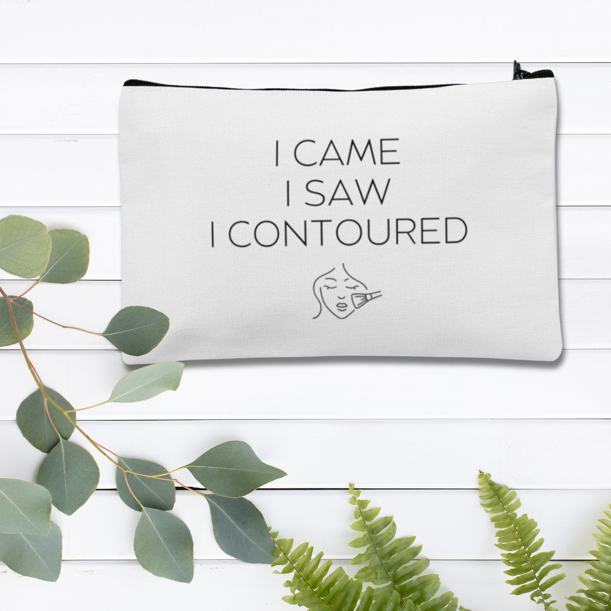 A custom makeup bag with the phrase 'I Came I Saw I Contoured,' making it a funny and stylish gift for women. Perfect for those looking for unique and personalized cosmetic bags.