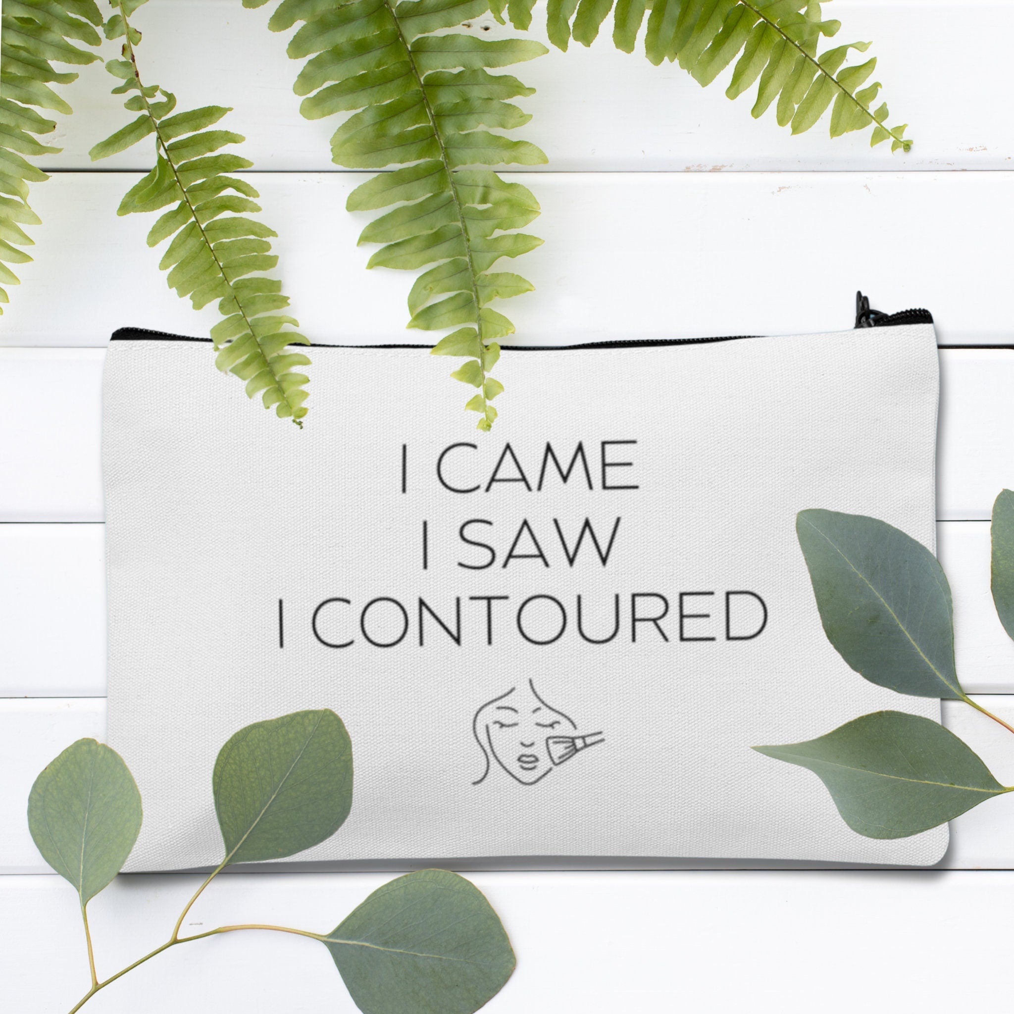 A custom makeup bag with the phrase 'I Came I Saw I Contoured,' making it a funny and stylish gift for women. Perfect for those looking for unique and personalized cosmetic bags.