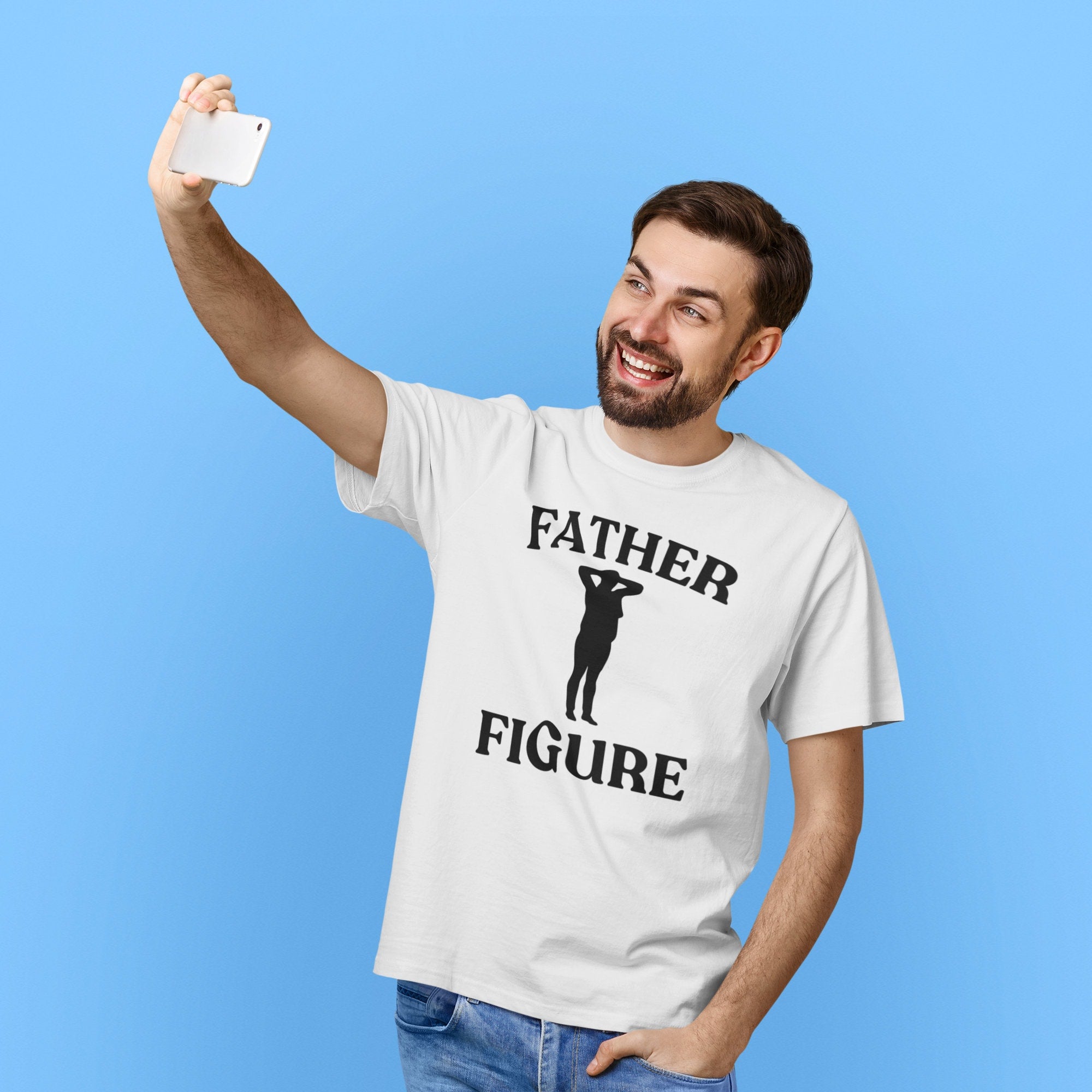 Man taking selfie with white shirt on with the phrase 'Father Figure,' making it a funny and custom Father's Day gift for dads. Perfect for those looking for unique and humorous dad shirts.