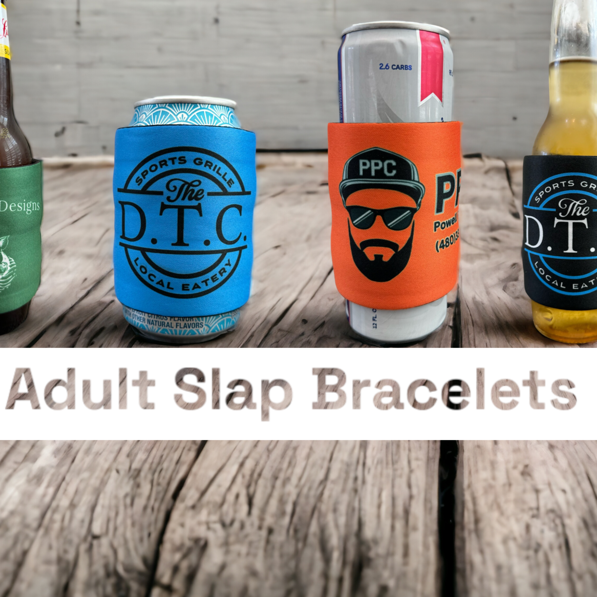 Four beverage cans and bottles wrapped in colorful slap wrap drink sleeves branded with logos for "After Five Designs," "The D.T.C. Sports Grille," and "PPC Powell Pool Co.," showcasing new adult slap bracelets as beverage holders.